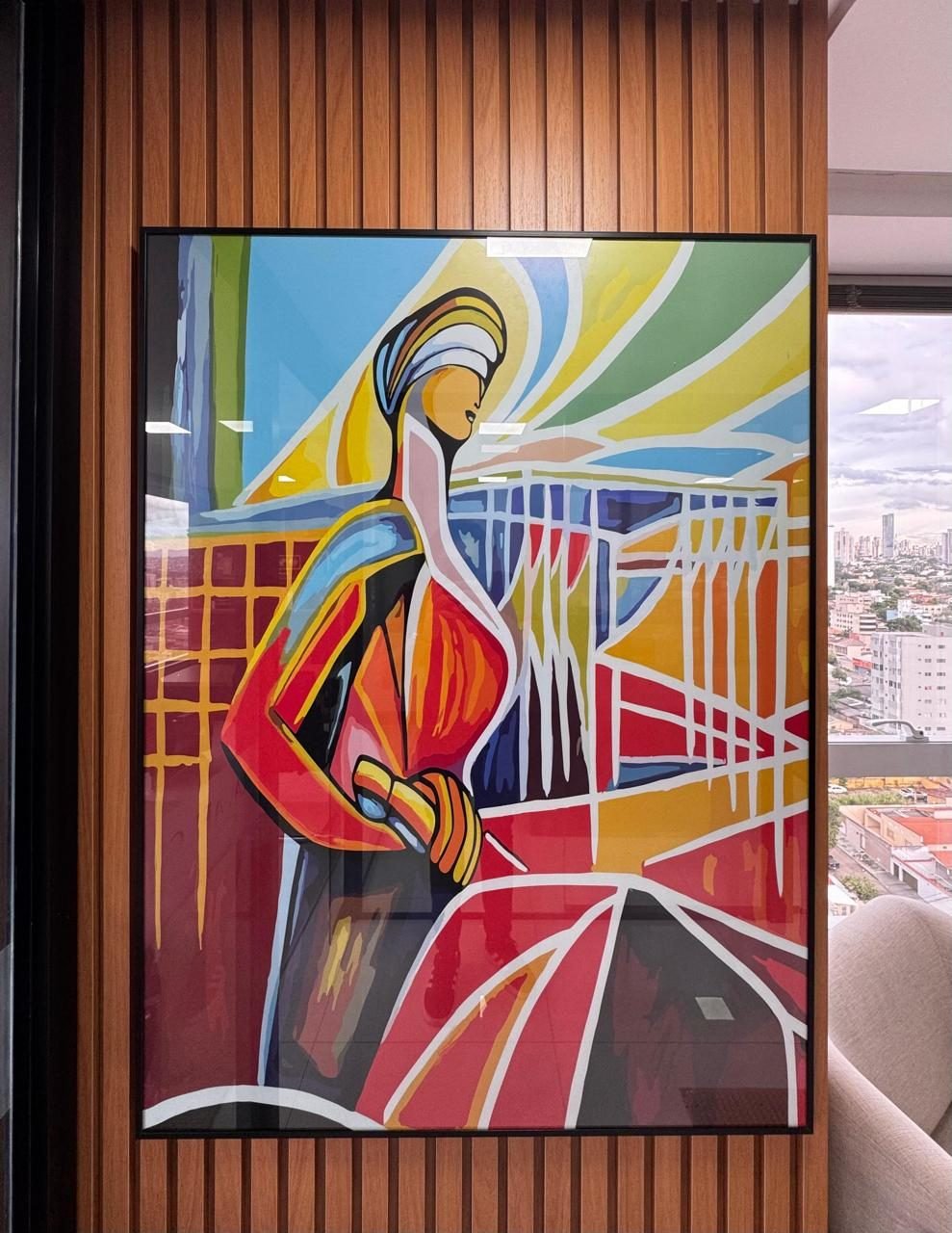 Quadro na parede do escritório, ao lado da janela com vista para Goiânia
